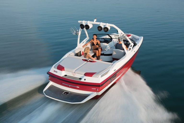 A sleek motorboat cruising through calm waters on a sunny day, representing the need for reliable boat and personal watercraft insurance