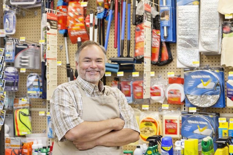 An image of a happy business owner smiling or celebrating, perhaps in front of their commercial property or at their workplace. The visual conveys satisfaction and success, reflecting the peace of mind that comes with having reliable insurance coverage