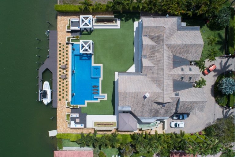 Large house with a pool, representing high-value property and luxury living