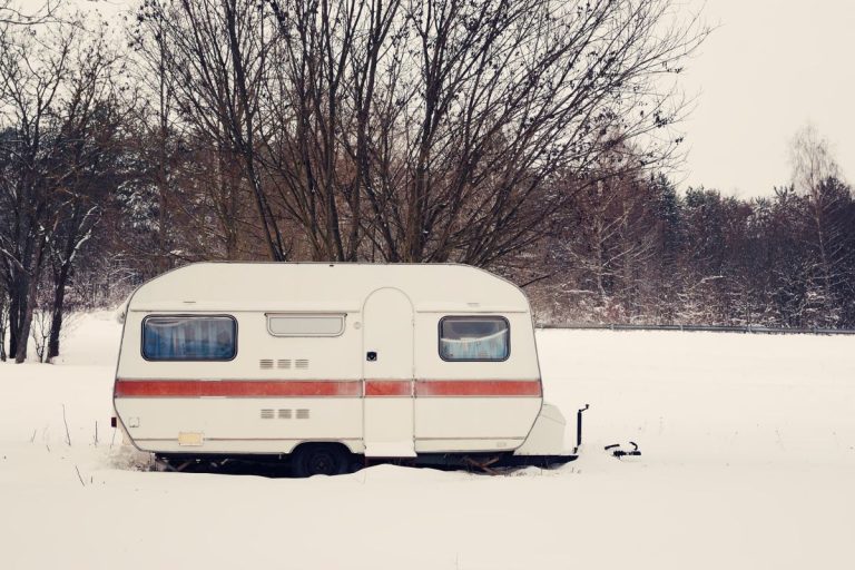 Mobile home prepared for winter with insulated pipes and secure skirting to winterize your mobile home.